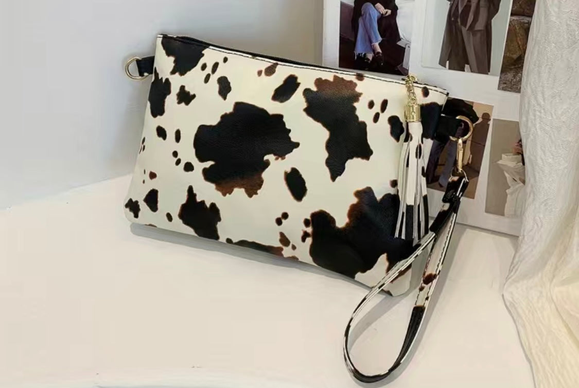 Cow Print Faux Leather Clutch with Tassel & Wristlet Strap